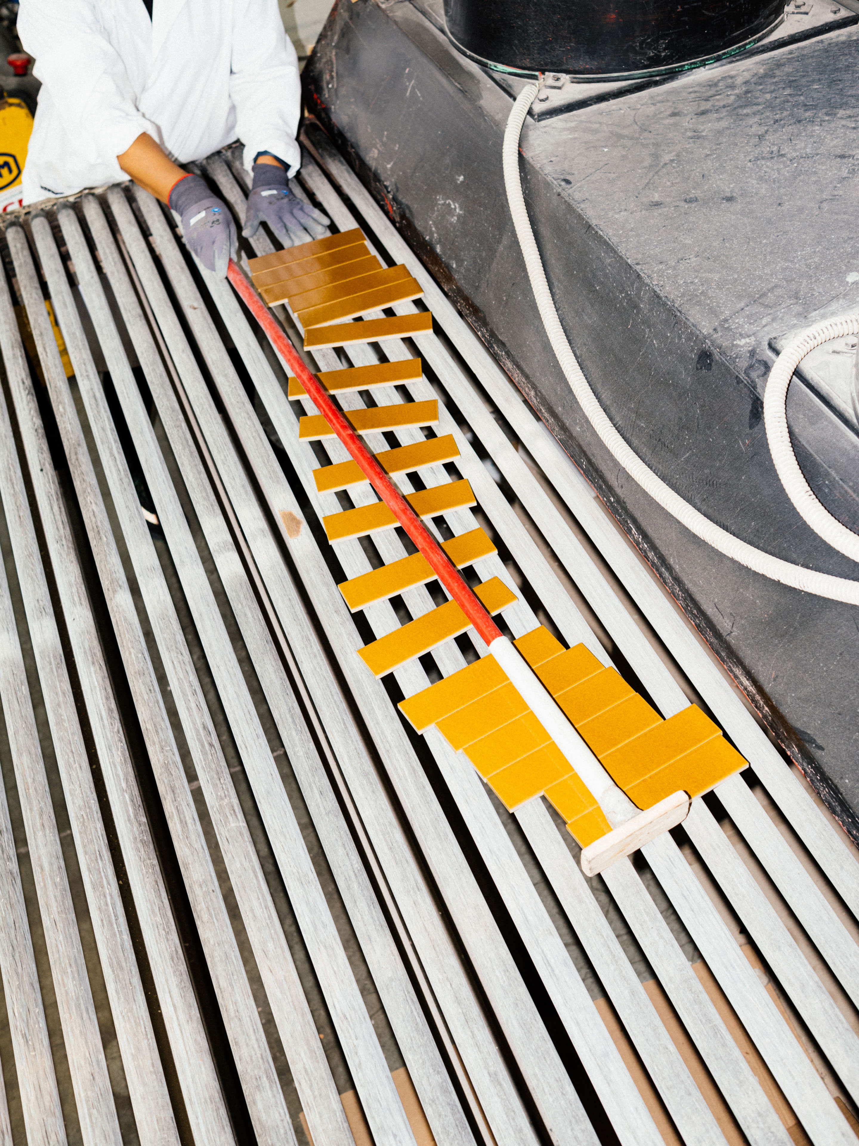 FULLY GLAZED EXCINERE TERRA TILES COMING OUT OF THE KILN